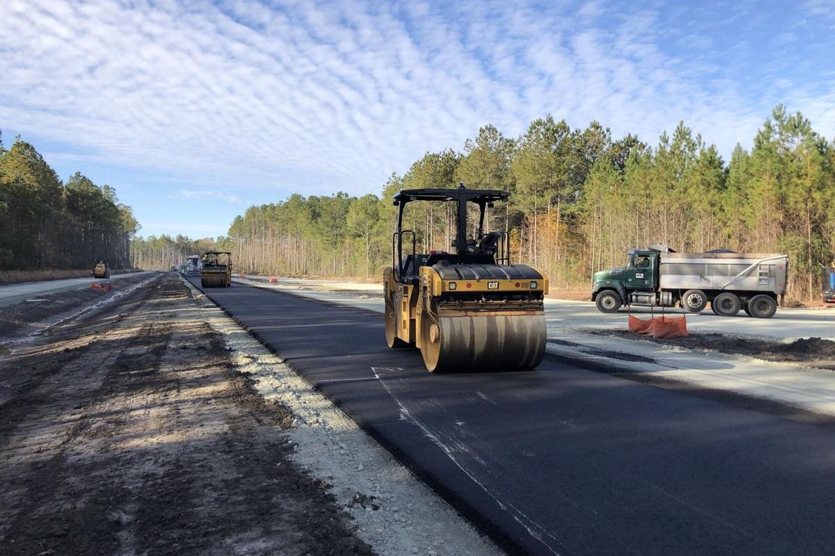 Paving crews laying new asphalt on the Nexton Parkway widening project
